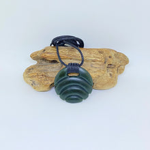 Load image into Gallery viewer, Carved Ridge bound Porohita Disc Pendant