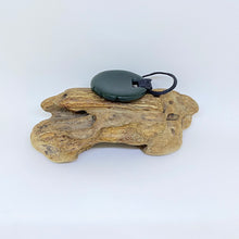 Load image into Gallery viewer, Carved Ridge bound Porohita Disc Pendant
